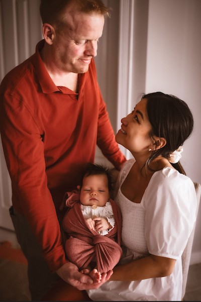 Suki and Ben O'Connor holding their daughter