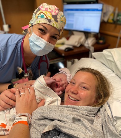 Brittney Paxson with her baby and a maternity nurse